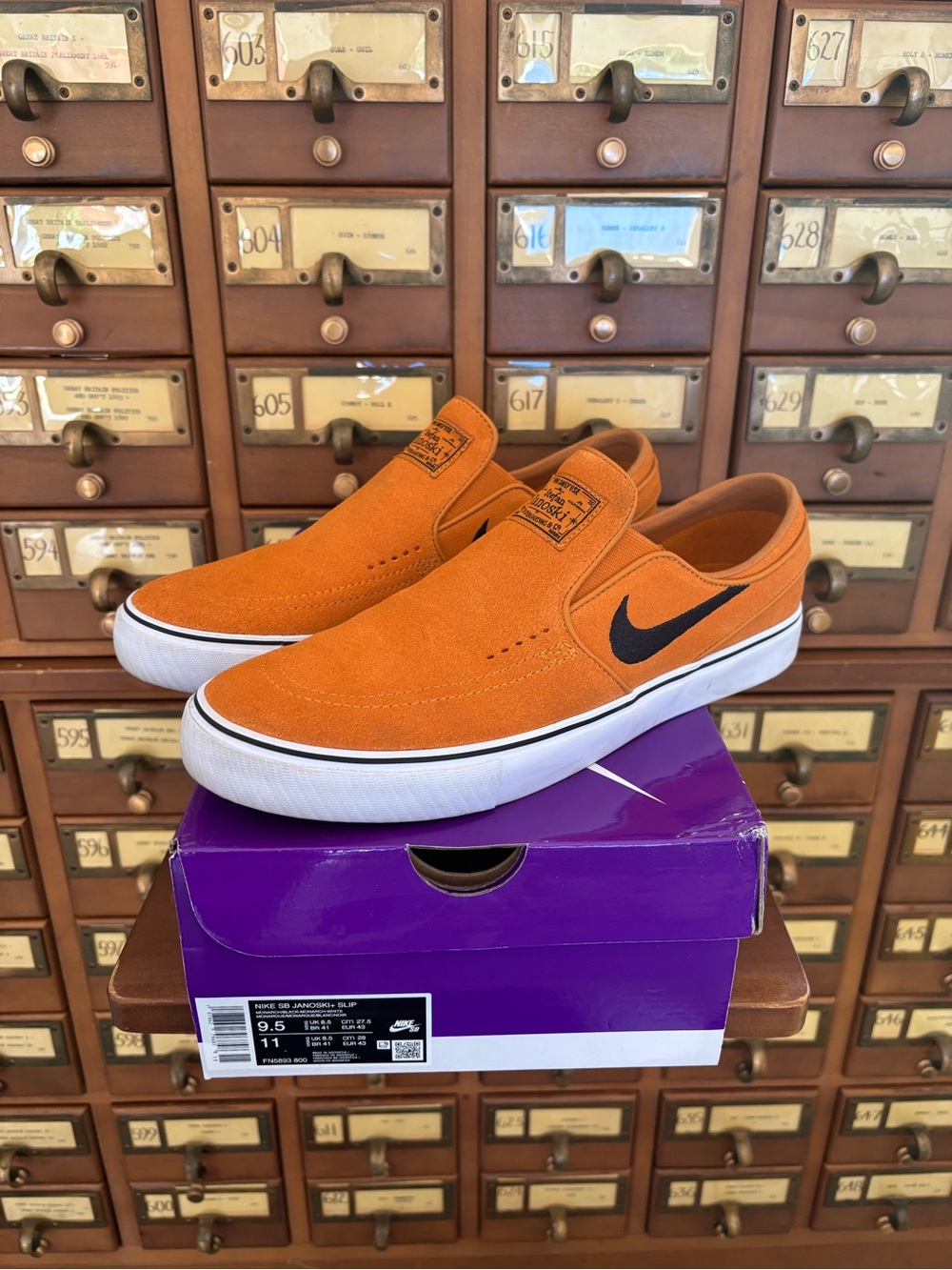 Nike Men’s Orange Suede Slip-On Sneakers with Black Swoosh